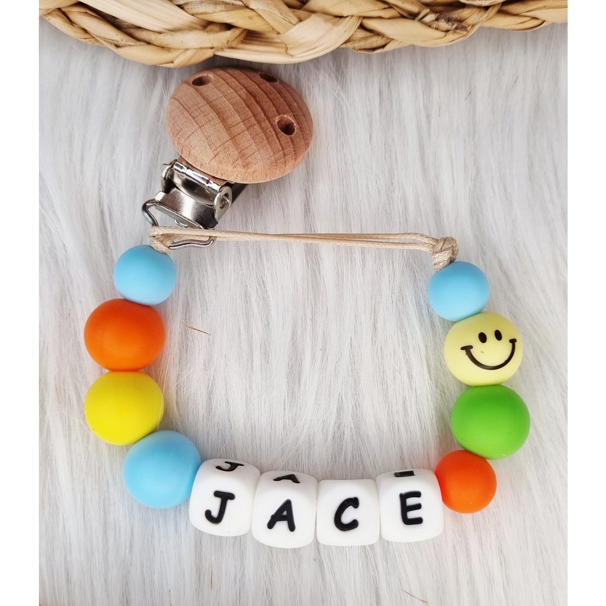 Speenkoord met naam Smiley babyblauw