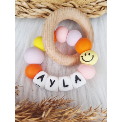 Bijtring met naam Smiley babypink